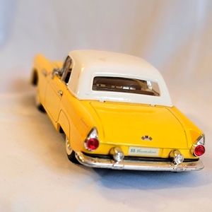 Yellow Ford Thunderbolt Convertible Vintage Car